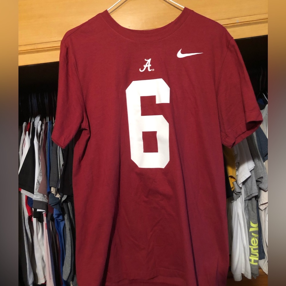 Red Nike baseball tee shirt.